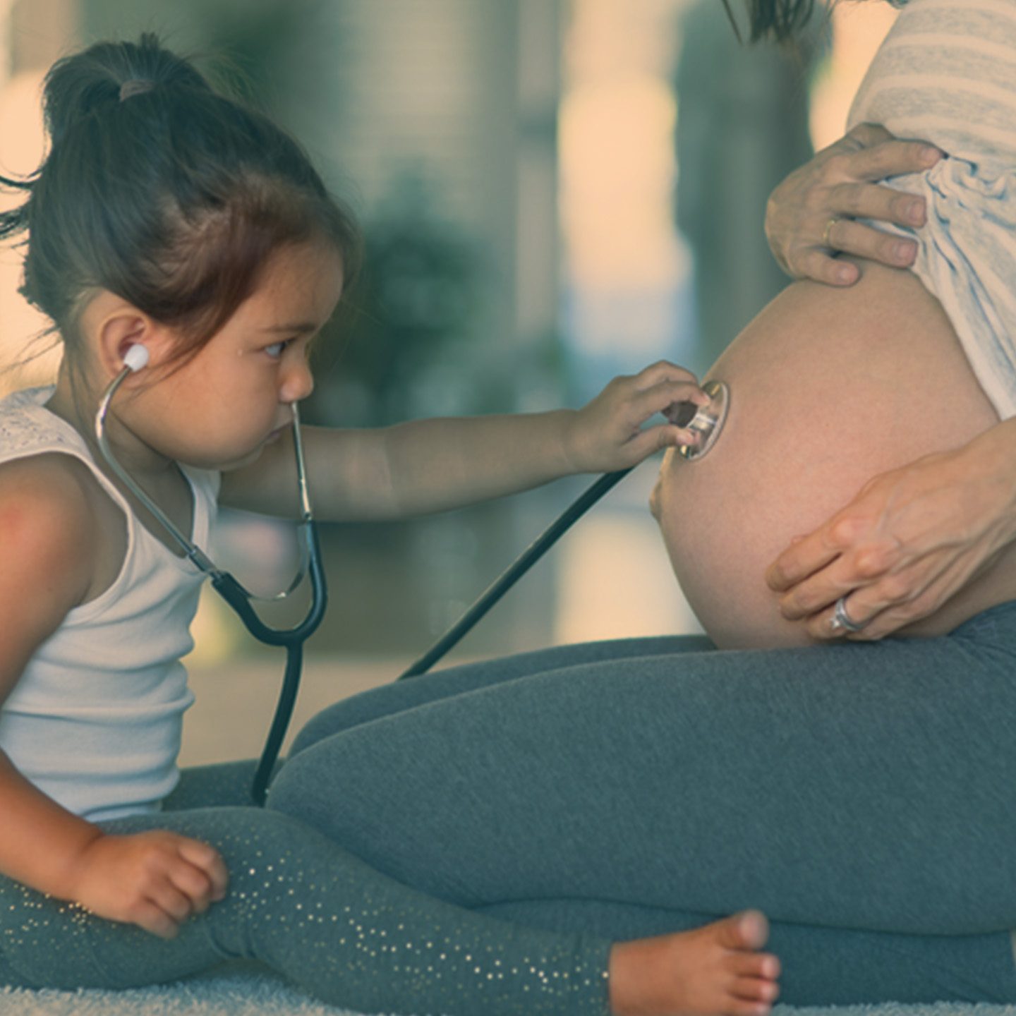 Pregnant woman with young child